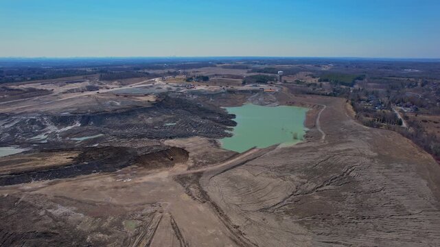 Aerial view of mining sector field. Concept of rapid expanding global market for semiconductors, and supply chains for AI systems and data centres. Rear earth development demand by memory chip makers.