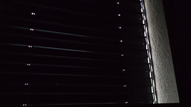 Automatic exterior window blinds closing view towards street modern building shading system