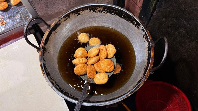 Cooking process of local street food in a pan