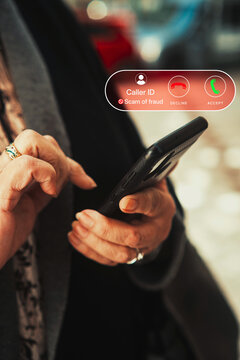 Scam Phone Call Alert on Smartphone Held by Senior Woman Warning of Fraud. Cybersecurity awareness, consumer protection, telecom, and online fraud prevention.