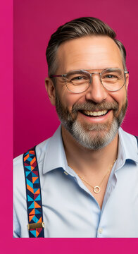 Close-up of a smiling mature man with glasses, wearing a light shirt and colorful suspenders, representing confidence and happiness, professional image
