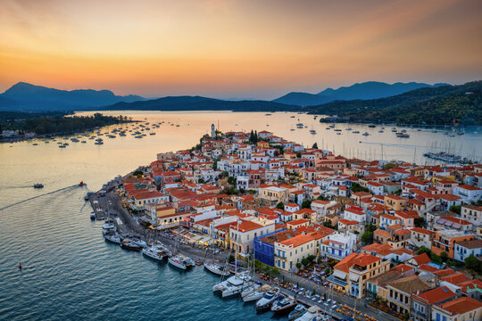 Aerial view of the port and town at Poros island in the Saronic Gulf, Greece, during a beautiful summer sunset