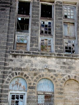 old building facade with broken windows