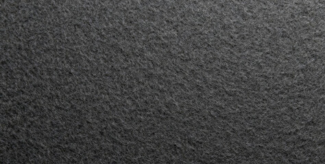 Fototapeta premium Industrial product black fabric material background texture. Seamless gray felt cloth fibre pattern.