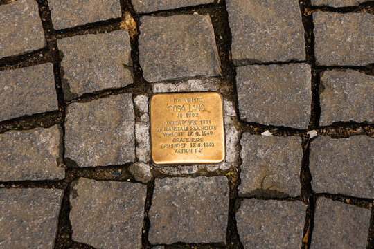 Konstanz, Germany- May 28, 2025: Rosa Lang Stolperstein memorial cube. Brass plate inscribed with the name and life dates of victims of Nazi extermination or persecution