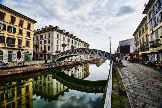 The Naviglio Grande canal, featuring the iconic iron pedestrian bridge known locally as El pont de fer Milan, Italy, Europe 