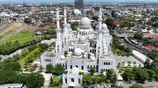Aerial view of Sheikh Zayed Grand Mosque Solo Surakarta with its white domes and minarets in Kecamatan Banjarsari, Jawa Tengah, Indonesia.