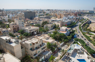 Fototapeta premium An aerial view of Tripoli, Libya, overlooking buildings and roads, looking in a westerly direction.