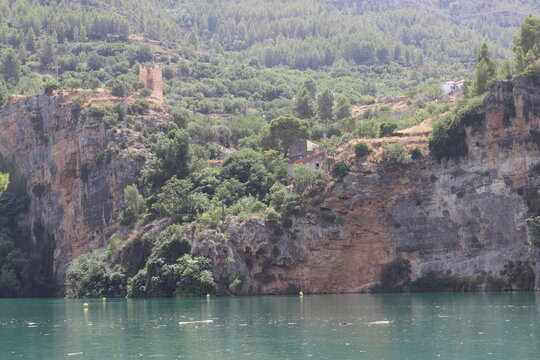 Ancient Watchtower and Rural Houses on Limestone Cliffs in Cortes de Pallas