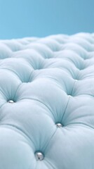Fototapeta premium Light blue tufted upholstery closeup on soft background