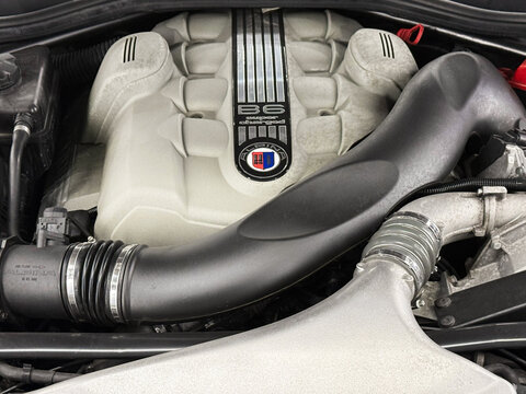 V8 engine of BMW ALPINA E63 Under the bonnet sits a supercharged 4.4-litre V8, delivering 500hp, 516lb-ft of torque. Engine motor of BMW ALPINA E63, E64 B6 with emblem close-up. BMW ALPINA E63, E64. 