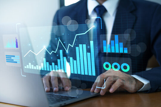 Data Analytics concept, Data Annotation, Data Analysis, Smile businessman use laptop analyzing data for competitor benchmarking and market positioning