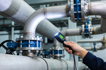 Industrial inspection of large metal pipes with a flashlight and digital device © Snide12