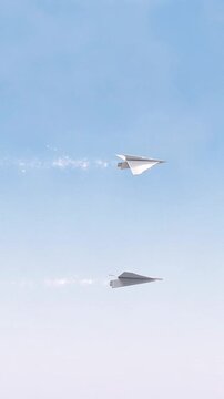 Two white paper airplanes flying in the air with sparkles and smoke trails  clear blue sky background
