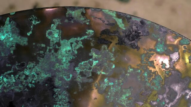 Close-up of aged copper patina with vibrant green verdigris and metallic sheen