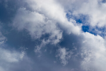 Obraz premium Beautiful blue sky with white fluffy clouds, natural daytime image, cloudscape with copy space. Scenic beauty of nature of Leh, Ladakh, India. Ladakh is known for clear atmosphere, bright environment.
