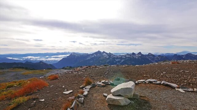 A panoramic view of rugged mountain peaks, part of the Tatoosh range, poking through a sea of clouds as seen from Panorama Point on the Skyline Trail in the Paradise area of Mount Rainier National Par