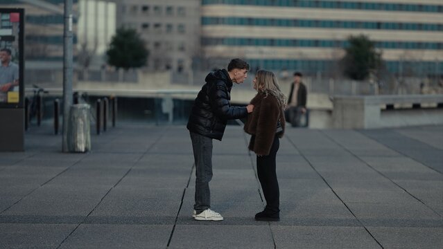 Young Couple Arguing In Paris France With Modern Architecture Background Relationship Problems And Emotional Stress In Urban Environment