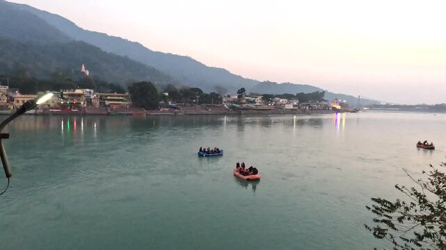 River Rafting on Ganges in Rishikesh with Scenic Himalayan Town and Evening Lights