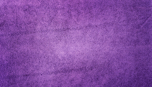 Suede texture of violet color as a background macro photo.