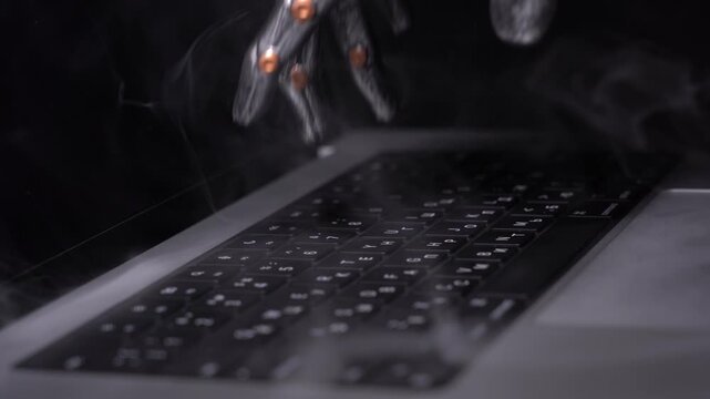 Close-up of a robotic hand typing on a laptop keyboard. Metal fingers press keys with orange joint accents. Steam rises from the hot keyboard surface