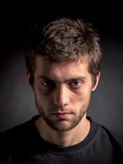 Fototapeta premium Gloomy portrait of a handsome man
