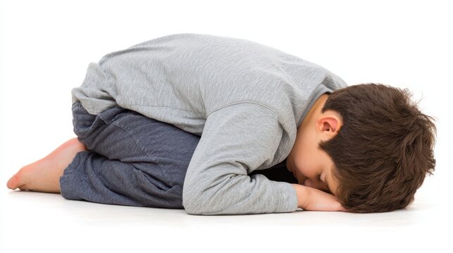 Young boy rests on stomach boy in relaxed prone position young boy rests on stomach