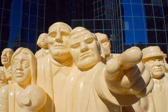 MONTREAL CANADA : The "Illuminated Crowd" is a public sculpture, made in 1985 by artist Raymond Mason from stratified polyester resin with polyurethane paint.