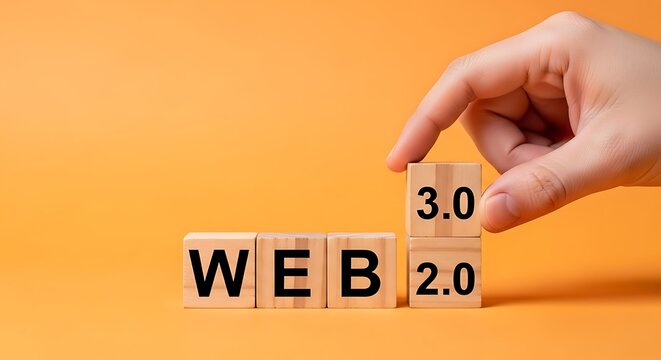 Hand placing Web 3.0 block over Web 2.0 blocks