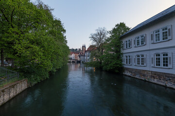 Fototapeta premium Margarete Mueller Bull Steg bridge over Rossneckar canal with view towards the historic old town. Esslingen am Neckar, Baden-Wuerttemberg, Germany.