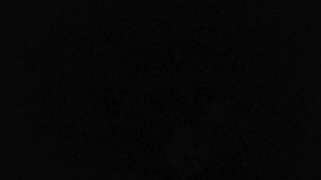 Powerful Bright purple lightning flashes flickering rapidly on a dark sky in a widescreen view