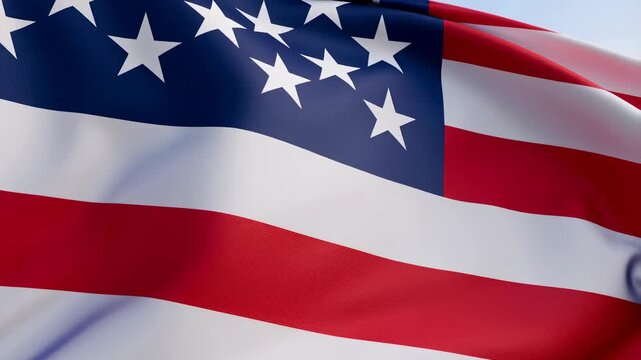 American flag waving in the wind against a clear blue sky. Symbol of patriotism, national pride, and unity
