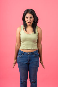 Young woman showing disgust grimacing facial expression