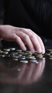 Man hands sorting and mixing various coins on table close up, money concept, wealth and financial success with ASMR audio foley
