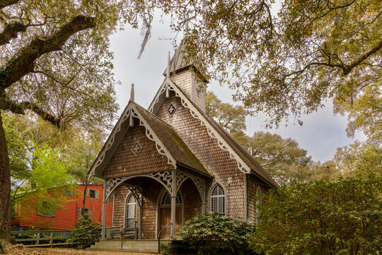 the historic St. James-Santee Episcopal Church framed by live oaks in early spring