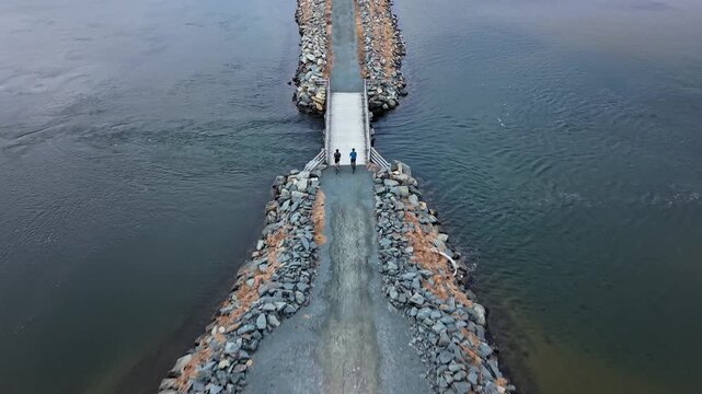 Aerial View Two Cyclists Riding Gravel Causeway Salt Marsh Trail Cole Harbour Heritage Park Halifax Nova Scotia Canada Ocean Inlet Outdoor Activity Active Lifestyle Scenic Nature