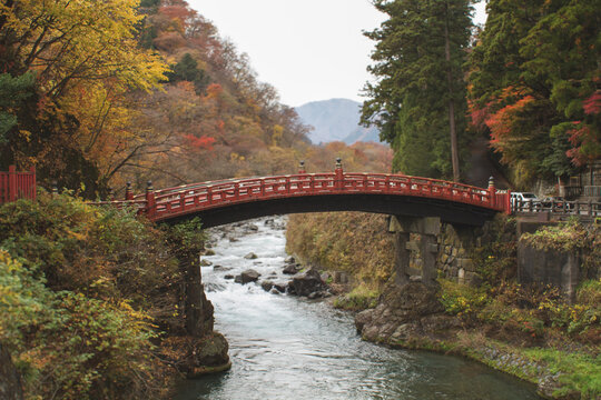 The iconic vermilion Shinkyo Bridge spanning the Daiya River during autumn in Nikko, Japan