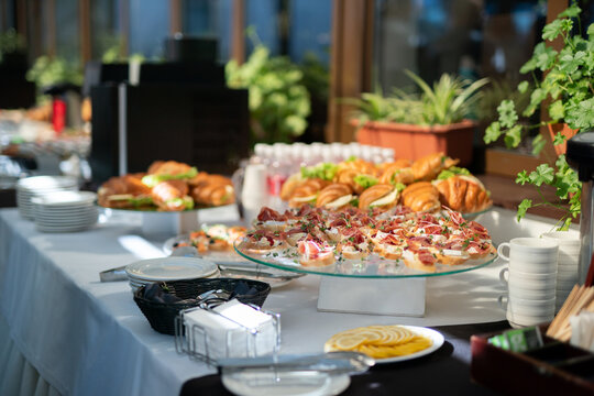 Buffet table with assorted bruschettas and croissants