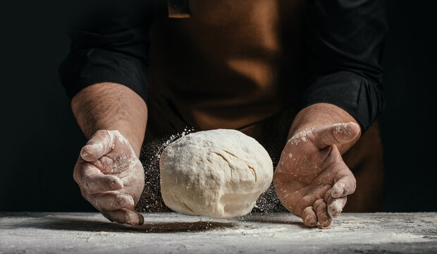 Floating dough between baker hands with flour dust, artisan bread concept banner