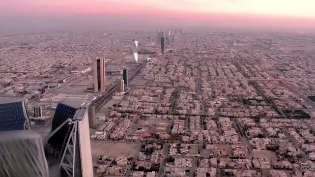 Panoramic Drone View of Riyadh City Skyline Featuring Kingdom Centre and Urban Traffic