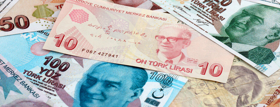 Turkish lira money banknotes pile on table. Turkey bills of TRY currency. Concept of economy