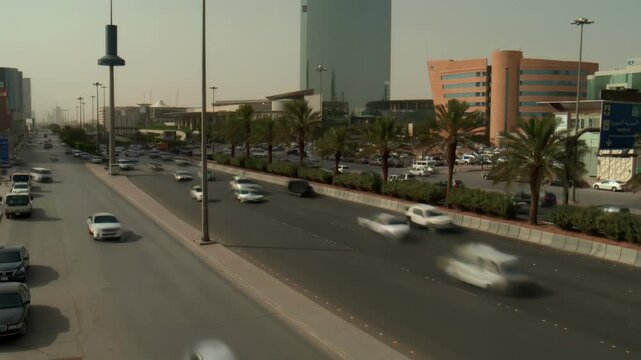 Riyadh City Skyline Aerial View Featuring Kingdom Tower and Heavy Traffic Flow on King Fahd Road, Saudi Arabia.