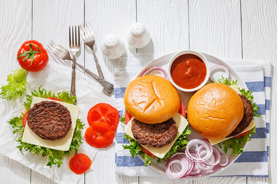 Beef cheeseburgers with brioche buns on a plate