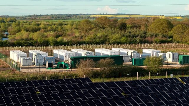 Aerial view of Tiln Battery Energy Storage System featuring solar panels and utility containers surrounded by green fields in Retford, England, United Kingdom.