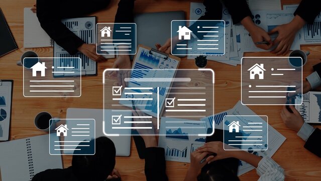 Collaborative Business Meeting on Real Estate Analysis with Graphs and Progress Checklists Overlaid on a Wooden Table Gluon.