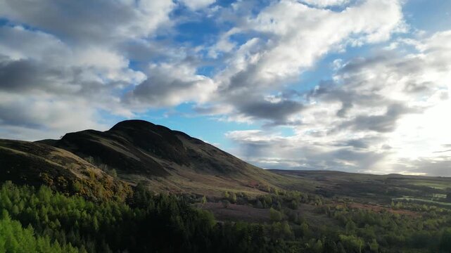 Aerial View of Balmaha Valley Glasgow Landscape over Mountains of UK During Sunset Time. The village is a popular tourist destination for picnickers and day trippers from Glasgow Scotland, UK