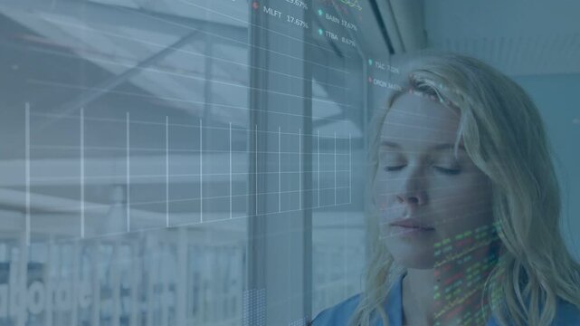 Woman standing by window, charts on glass appearing closing eyes then smiling showing tech insight