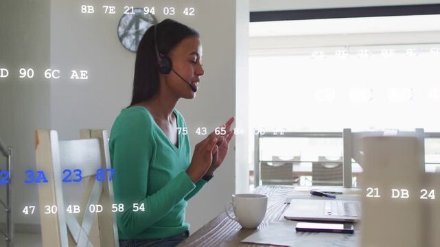 Vertical video: Woman on cue, speaking, gesturing to laptop while hex overlaying view for business