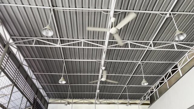 Industrial Interior with Galvalume Steel Roof and Spinning Fans