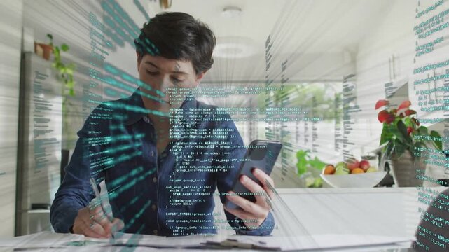 Woman checking phone and writing bills in kitchen, causing glowing finance code bands moving across